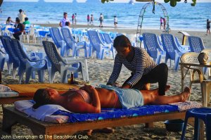 Koh Chang, Thailand. Traditional Thai massage is available in the shade of big beach trees on most beaches here.